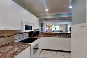 Enjoy cooking in this well-equipped kitchen with appliances and a spacious island.