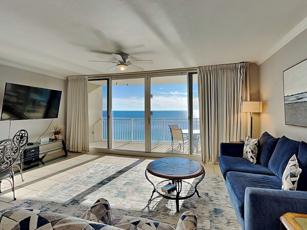 Enjoy ocean views from the balcony and relax in the comfortable seating area with a sofa and flat-screen TV.