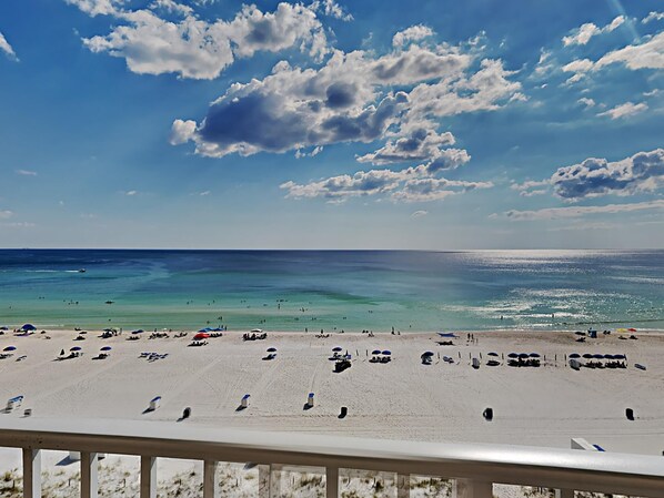 A beach with clear skies and a calm sea. - Long Beach I #702 | Gulf-Front Views! (Panama City Beach)