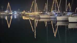 A marina at night with boats docked and their masts illuminated by lights. - Apartment type T2 bis town center all on foot near beach (Cavalaire-sur-Mer)