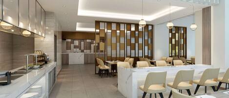 A modern hotel lobby with a reception desk, seating area, and a large dining table.
