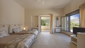 A hotel room with two beds, a TV, a large window with a view of greenery, and a balcony. - Crystal View Villa by Unique Villas Collection (Corinth)