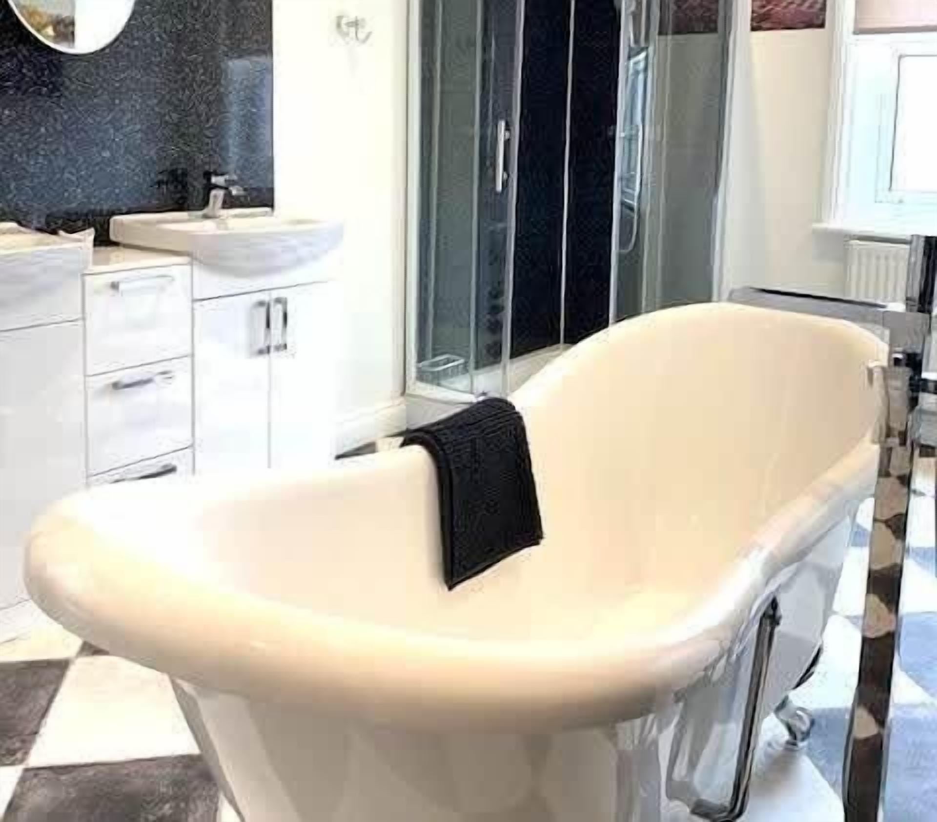 Bathtub, hair dryer, towels