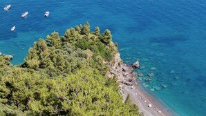 A coastal area with a beach, boats, and dense greenery. - VILLA OASI - Four Bedroom Villa, Sleeps 8 (Positano)