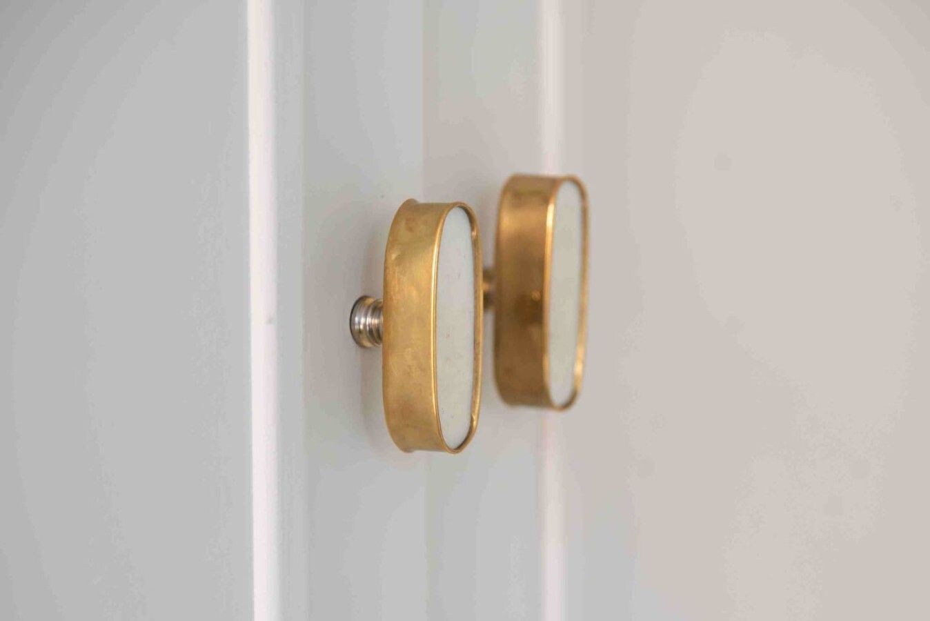 A pair of gold-colored door handles.