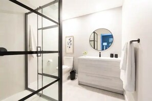 Shower, hair dryer, towels, soap