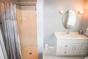 Shower, towels, soap, toilet paper