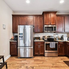 Fridge, coffee/tea maker, cookware/dishes/utensils