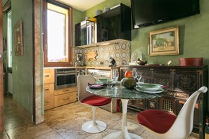 Enjoy meals in the kitchen with an oven and microwave, and dine at the table with two chairs.