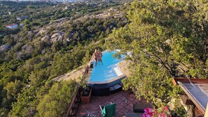 A pool area with a view of the sea and surrounding hills. - Villa Vista, from the terrace a stunning view to  Costa Smeralda and the Islands (Sardegna)
