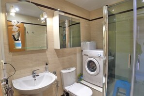Bathtub, hair dryer, towels