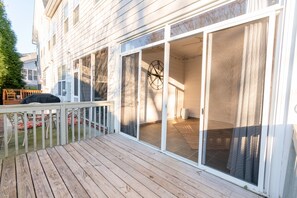 Enter a spacious interior through the sliding glass door.