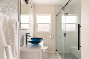 Shower, hair dryer, towels, soap