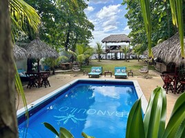 Outdoor pool, free cabanas, pool umbrellas