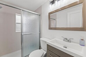 Shower, hair dryer, towels, soap