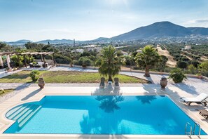 A swimming pool with a view of a mountain and a cityscape. - East Coast Mansion by Unique Villas Collection (Saronikos)