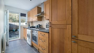 Comfort Apartment | Private kitchen | Full-size fridge, microwave, oven, stovetop