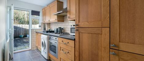 Comfort Apartment | Private kitchen | Full-size fridge, microwave, oven, stovetop