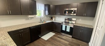 2 Separate Units in one Building w/ Private Entrances and Parking