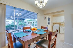 Enjoy meals in this dining area with a table for four, surrounded by a view of the outdoors.