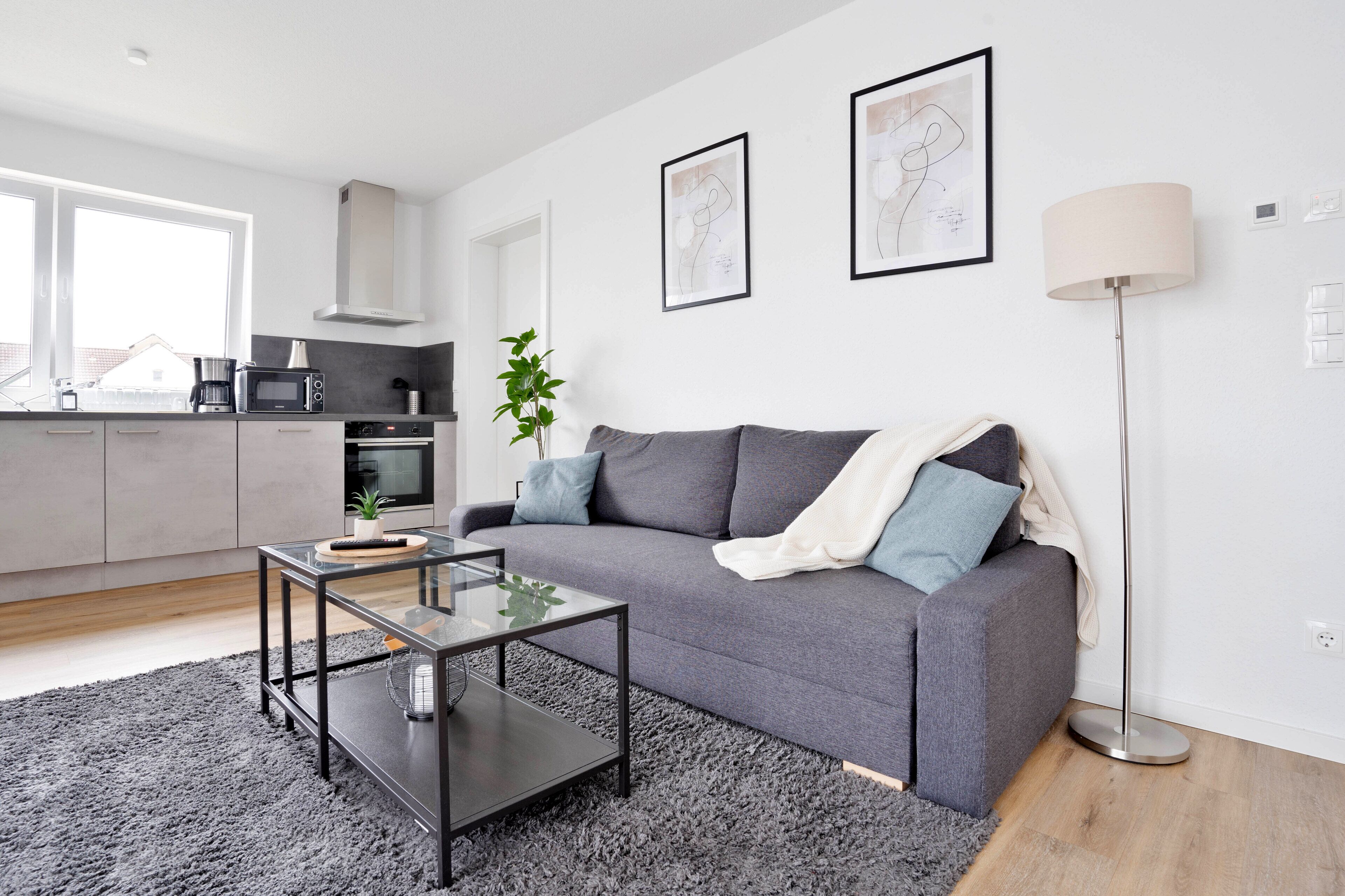 Panoramic-Apartment | Wohnbereich | Fernseher