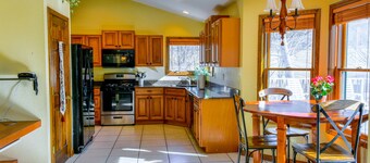 Creek-side home with private hot tub, game room, firepit, deck & mountain view