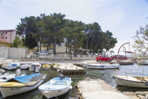 Boats docked at the marina, offering scenic views of the surrounding residential area.