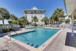 A swimming pool with a 3 FT depth marker, surrounded by lounge chairs and palm trees. - "Sea Drift" Steps to the White Sand Beaches! Close to Restaurants, Coffee Shops! (Navarre)