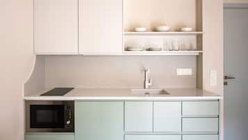 One Bedroom Apartment T | Private kitchen | Stovetop, cookware/dishes/utensils, spices, cleaning supplies