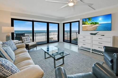 Updated direct oceanfront 2/2 with a balcony, beachfront heated pool and beach access