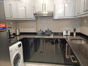 Fridge, microwave, stovetop, coffee/tea maker