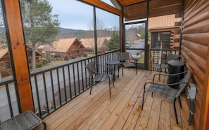 Enjoy outdoor dining or relaxation on the deck with a view of the surrounding area.