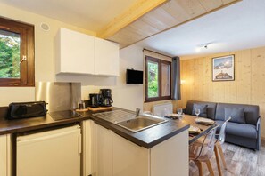 Fridge, microwave, stovetop, coffee/tea maker