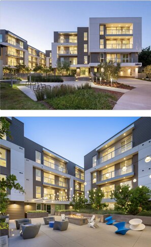 Experience modern living with large windows, balconies, and a landscaped ground level with fire pit and outdoor seating.