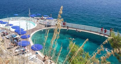 Villa Capo d'Arco with sea view, in an exclusive location inside the Residence with use of pools and