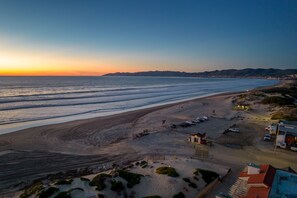 Enjoy a serene beach experience with access to the ocean and ample parking.