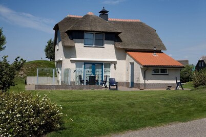 Thatched villa with bath in a holiday park