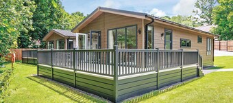 Luxurious lodge with one king-size double, with en suite shower and one twin.