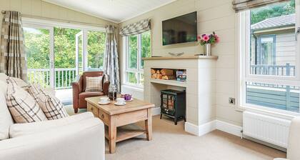 Luxurious lodge with one king-size double, with en suite shower and one twin.