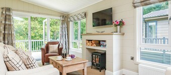 Luxurious lodge with one king-size double, with en suite shower and one twin.