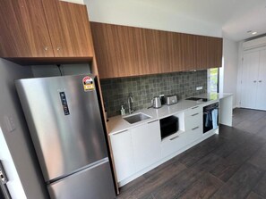 Kingfisher Suite | Private kitchen | Microwave, stovetop, electric kettle, toaster