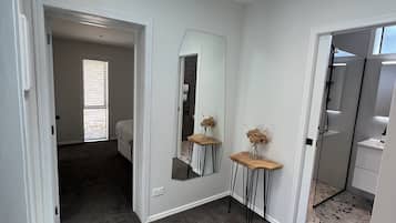 Shower, rainfall showerhead, hair dryer, towels