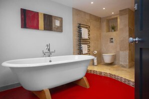 Bathtub, eco-friendly toiletries, hair dryer, soap