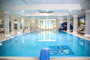 Indoor pool, seasonal outdoor pool, pool umbrellas, pool loungers