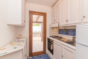 Fridge, stovetop, highchair, cookware/dishes/utensils