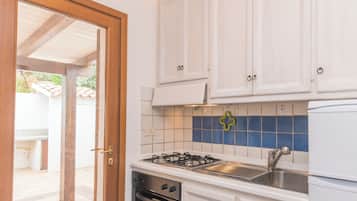 Fridge, stovetop, highchair, cookware/dishes/utensils
