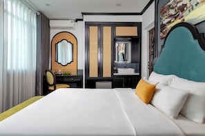A hotel room with a large bed, a desk, a chair, a wardrobe, and a bathroom. - Hanoi Elpis Hotel & Spa (Hanoi)