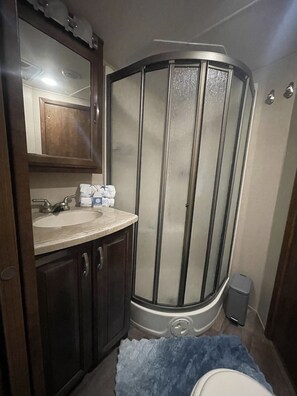 Shower, hair dryer, towels, soap