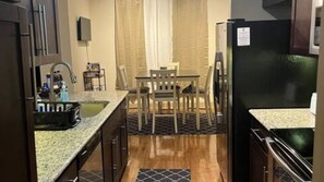 Luxury Single Room, 1 Bedroom | Private kitchen | Paper towels, dining tables - Inspired Realty Co (Houston)