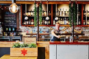 Enjoy a selection of craft beers and cocktails at our bar, featuring a variety of drinks and a welcoming atmosphere.